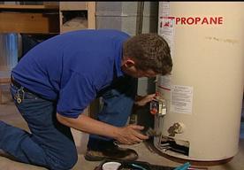 Rowlett plumber repairing a water heater